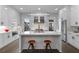 Modern kitchen with island, bar seating, stainless appliances, and white cabinetry at 574 Boulevard Ne Pl # 5, Atlanta, GA 30308