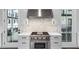 Close up of kitchen features, including stainless range and hood and white marble backsplash at 574 Boulevard Ne Pl # 5, Atlanta, GA 30308