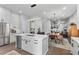 Open concept kitchen with white cabinetry, stainless appliances, and a kitchen island at 574 Boulevard Ne Pl # 5, Atlanta, GA 30308