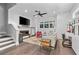 An inviting living room with fireplace and white brick accent wall, creating a cozy yet modern ambiance at 574 Boulevard Ne Pl # 5, Atlanta, GA 30308