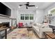 A sunlit living room features a decorative fireplace and a large window that frames lush greenery at 574 Boulevard Ne Pl # 5, Atlanta, GA 30308