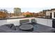 Relaxing rooftop deck with comfortable seating and city views at 574 Boulevard Ne Pl # 5, Atlanta, GA 30308