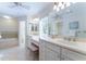 Bright bathroom featuring dual vanities, seated vanity, and tiled floors at 78 Paces West Nw Cir, Atlanta, GA 30327