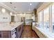 Contemporary kitchen with a large island, bench seating, and stainless steel appliances at 78 Paces West Nw Cir, Atlanta, GA 30327