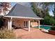 Image showing exterior of pool house structure with brick and light colored posts near fenced pool at 78 Paces West Nw Cir, Atlanta, GA 30327