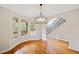 Elegant dining room with hardwood floors, bay window, and modern chandelier at 1655 Fate Conn Rd, Canton, GA 30114