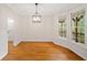 Bright dining room featuring hardwood floors and an abundance of natural light coming from bay windows at 1655 Fate Conn Rd, Canton, GA 30114