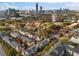 Stunning aerial view of townhomes surrounded by colorful trees in a vibrant community near the Atlanta skyline at 375 Highland Ne Ave # 908, Atlanta, GA 30312