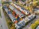 An aerial view showcasing a neighborhood's layout, with well-arranged townhomes and proximity to a main road at 375 Highland Ne Ave # 908, Atlanta, GA 30312