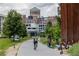 Well-maintained community path with lush greenery, bike racks, and scooter parking, promotes outdoor activity at 375 Highland Ne Ave # 908, Atlanta, GA 30312