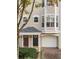 Townhouse featuring well-maintained landscaping and an attached garage at 375 Highland Ne Ave # 908, Atlanta, GA 30312