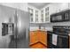 Close up of the modern kitchen with stainless steel appliances, stone counters and subway tile backsplash at 375 Highland Ne Ave # 908, Atlanta, GA 30312