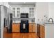 Modern kitchen with stainless steel refrigerator, granite counters and white subway tile backsplash at 375 Highland Ne Ave # 908, Atlanta, GA 30312