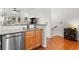 Open kitchen layout featuring granite counters, stainless steel appliances, and a view of the stairs at 375 Highland Ne Ave # 908, Atlanta, GA 30312