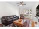 Spacious living room with hardwood floors, ceiling fan and large windows at 375 Highland Ne Ave # 908, Atlanta, GA 30312