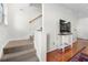 Carpeted staircase leading upstairs with view of the kitchen and hall at 375 Highland Ne Ave # 908, Atlanta, GA 30312