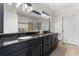 A spacious bathroom featuring a double sink vanity with dark granite countertops at 390 17Th Nw St # 1063, Atlanta, GA 30363