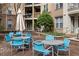 Inviting courtyard with ample seating under a large umbrella, perfect for relaxing and entertaining guests at 390 17Th Nw St # 1063, Atlanta, GA 30363