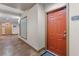 Well-lit hallway leading to unit #1063, featuring tile flooring and a view of the elevator lobby at 390 17Th Nw St # 1063, Atlanta, GA 30363