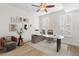 Bright home office with modern desk, comfortable chair, and stylish decor, illuminated by a ceiling fan at 390 17Th Nw St # 1063, Atlanta, GA 30363