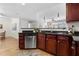 A modern kitchen featuring stainless steel appliances and dark countertops with matching cabinetry at 390 17Th Nw St # 1063, Atlanta, GA 30363