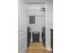 Convenient laundry room with side-by-side washer and dryer, and wire shelving for storage at 390 17Th Nw St # 1063, Atlanta, GA 30363