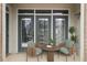 Inviting patio with a cozy seating arrangement, perfect for relaxing outdoors with a side table at 390 17Th Nw St # 1063, Atlanta, GA 30363