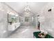 Spacious bathroom with a chandelier, dual vanity, and glass-enclosed shower at 8160 Stone Hill Rd, Cumming, GA 30028