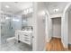 Bright bathroom with modern vanity and tiled walk-in shower at 8160 Stone Hill Rd, Cumming, GA 30028