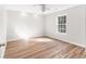 Bright, empty bedroom with hardwood floors and natural light at 8160 Stone Hill Rd, Cumming, GA 30028