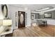 Elegant dining room with hardwood floors, chandelier, and views of the front yard at 8160 Stone Hill Rd, Cumming, GA 30028