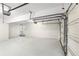 A clean, spacious garage with a functional door and ample room for parking and storage at 8160 Stone Hill Rd, Cumming, GA 30028