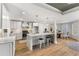 Open-concept kitchen features a large island, stainless steel appliances, and seating for casual dining at 8160 Stone Hill Rd, Cumming, GA 30028