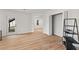 Open living area with hardwood floors, access to the backyard, and ample closet space at 8160 Stone Hill Rd, Cumming, GA 30028