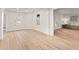 An open-concept living room with hardwood floors and lots of natural light at 8160 Stone Hill Rd, Cumming, GA 30028