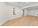 Spacious room with hardwood flooring and ample natural light, perfect for entertaining or relaxation at 8160 Stone Hill Rd, Cumming, GA 30028