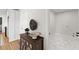 Mud room features a tile floor, natural lighting, and leads to the kitchen and laundry room at 8160 Stone Hill Rd, Cumming, GA 30028