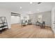 Bright home office featuring hardwood floors, neutral decor, and views of the outdoors at 8160 Stone Hill Rd, Cumming, GA 30028
