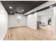 Versatile space with hardwood floors, a black ceiling and access to the backyard at 8160 Stone Hill Rd, Cumming, GA 30028