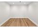 Empty room featuring recessed lighting and hardwood flooring at 8160 Stone Hill Rd, Cumming, GA 30028