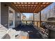 Inviting covered back porch with outdoor seating, a grill, and a fun slide at 1617 Matt Springs Dr, Lawrenceville, GA 30045
