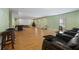 Open basement layout featuring home theatre seating, laminate floors, and a festive holiday tree at 1617 Matt Springs Dr, Lawrenceville, GA 30045