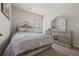 Bedroom with coordinated gray and silver furniture and decor at 1617 Matt Springs Dr, Lawrenceville, GA 30045