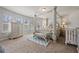 Bedroom with four poster bed, carpet flooring, and neutral decor at 1617 Matt Springs Dr, Lawrenceville, GA 30045