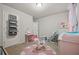 Charming ' bedroom with a rocking horse, space to play, and cozy accents at 1617 Matt Springs Dr, Lawrenceville, GA 30045