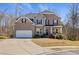 Charming two-story brick home with a well-maintained front yard and an inviting entrance at 1617 Matt Springs Dr, Lawrenceville, GA 30045
