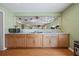 Functional wet bar featuring wood cabinets, granite countertops, and a stylish backsplash mirror at 1617 Matt Springs Dr, Lawrenceville, GA 30045