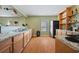 Well-lit kitchen with wood cabinets, granite countertops, and modern stainless steel appliances at 1617 Matt Springs Dr, Lawrenceville, GA 30045