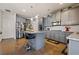 Modern kitchen featuring gray cabinets, stainless steel appliances, and granite countertops at 1617 Matt Springs Dr, Lawrenceville, GA 30045