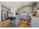 Modern kitchen featuring gray cabinets, stainless steel appliances, and granite countertops at 1617 Matt Springs Dr, Lawrenceville, GA 30045